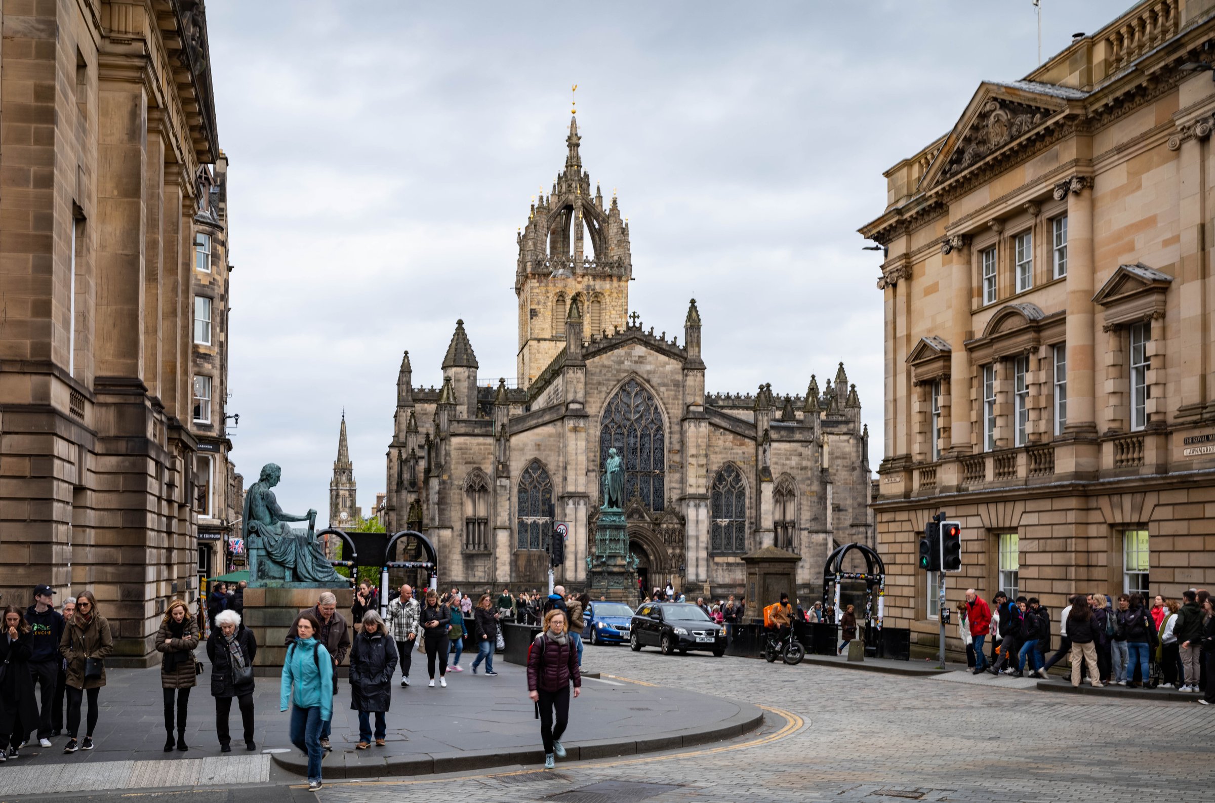 Street view along Edinburgh's Royal Mile lined with historic buildings.